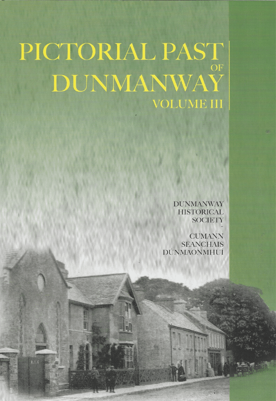Book cover for "PICTORIAL PAST OF DUNMANWAY VOLUME III" set against a green background with a blurred grass texture. Yellow text on the right reads "DUNMANWAY HISTORICAL SOCIETY CUMANN SEANCHAIS DÚNMAONMHUÍ". At the bottom is a sepia photograph of a large stone building with gables and a few figures on the pavement outside.