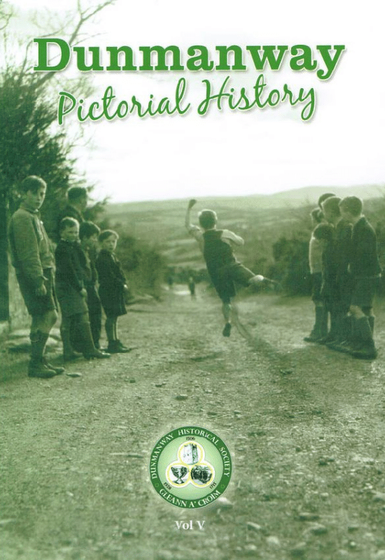 Book cover for "Dunmanway Pictorial History Vol V". The background is green. A large sepia photograph shows a group of boys watching as one boy throws a metal bowl on a rural dirt road. The Dunmanway Historical Association logo is at the bottom centre, above the text "Vol V".