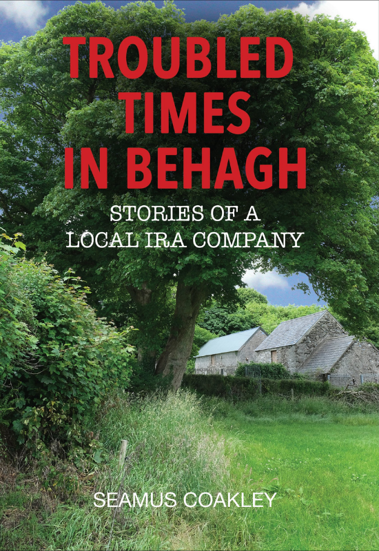 Cover of the book 'Troubled Times in Behagh: Stories of a Local IRA Company' by Seamus Coakley. The cover features the main title in large, bold red letters at the top. The background is a colour photograph of a vibrant, lush green landscape featuring a large, leafy tree in a grassy field, with traditional stone farm buildings nestled in the background beneath a partly cloudy blue sky.