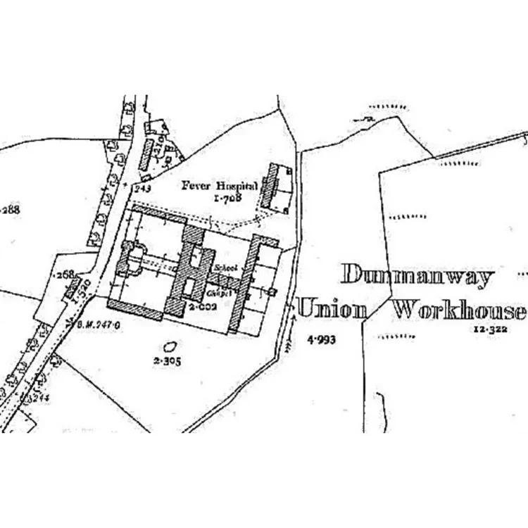 A black and white historical Ordnance Survey map section focusing on the layout of the Dunmanway Union Workhouse. The map clearly outlines the footprint of the large, H-shaped main workhouse building complex, containing labels for a "School" and a "Chapel". Just north of the main complex, a separate building is labelled "Fever Hospital". A main road runs vertically along the left edge of the property.